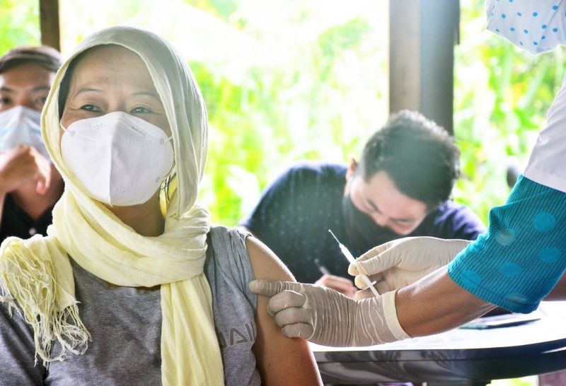 A beneficiary gets the vaccine shot during a COVID-19 vaccination drive in Dimapur. (Morung File Photo)